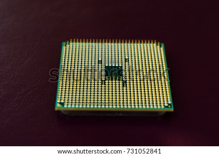 Central computer processor on dark backgrounds from places under the inscription Royalty-Free Stock Photo #731052841
