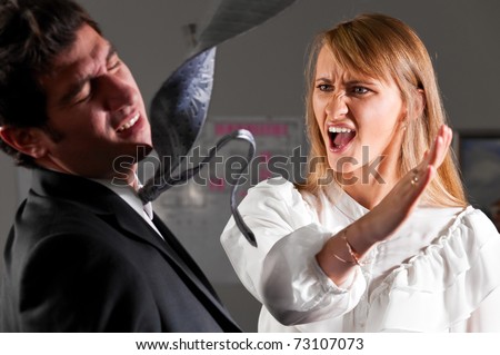 angry businesswoman is slapping across the businessman's face Royalty-Free Stock Photo #73107073