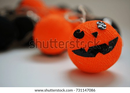 Cotton ball lights shape of pumpkin used to decorate in Halloween with copy space for text.