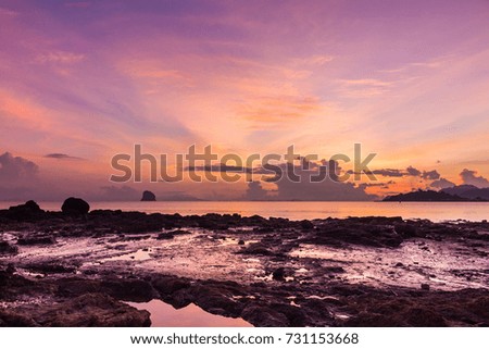 Morning sunlight With rocks and sea background