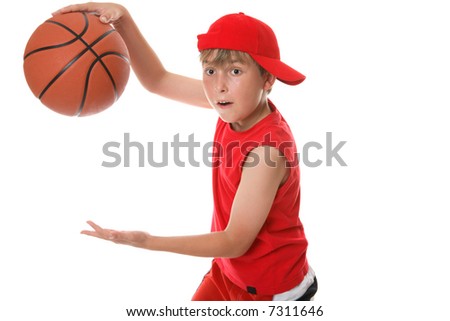 A child in action playing a game of basketball