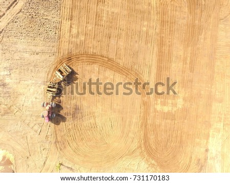 Tractor excavating farm land