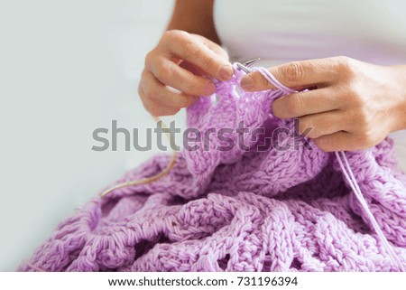 knitting with lilac and violet color knitting needles