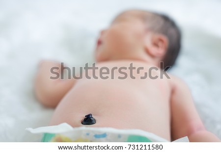 Navel newborn baby girl. Newborn baby girl sleeping peacefully. Royalty-Free Stock Photo #731211580