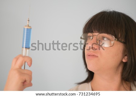 woman with a syringe in her hands