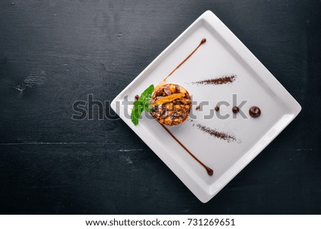 Nut Milk Chocolate Dessert. Top view. Free space for text. On a wooden background.