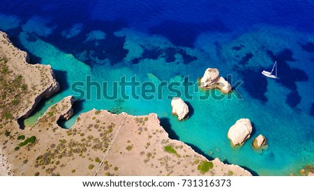 Aerial birds eye view photo taken by drone depicting beautiful deep blue turquoise waters and lovely rocky seascape in Glaronisi islet, Koufonisi island, Cyclades, Greece