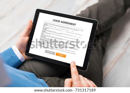 Man reading lease agreement.