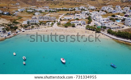 Summer 2017: Aerial birds eye view photo taken by drone depicting beautiful deep blue -
 turquoise waters and small port with traditional fishing boats