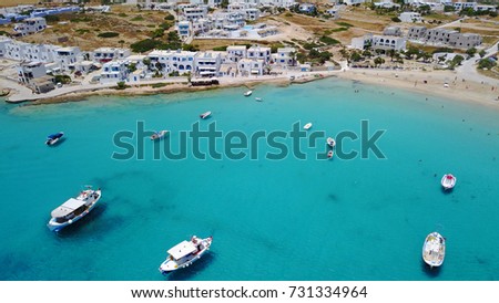 Summer 2017: Aerial birds eye view photo taken by drone depicting beautiful deep blue -
 turquoise waters and small port with traditional fishing boats