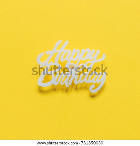 inscription Happy Birthday on a yellow background. minimal