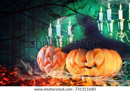 Pumpkins Burning In A Spooky Forest At Night - Halloween Background