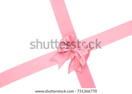 Beautiful big pink bow with tails for gift decoration with crosses silk ribbons on white background