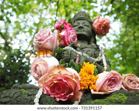 goddess statue with flowers