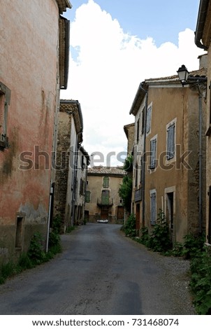 idyllic narrow street in old town village in europe, alleyway 