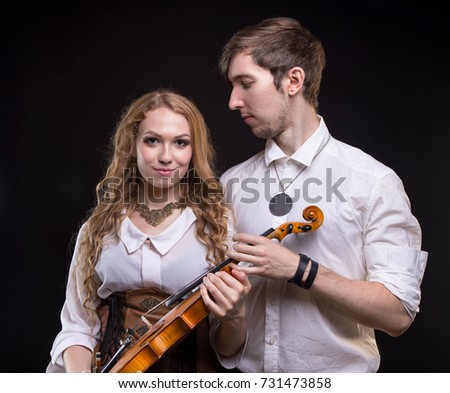 Musical loving couple with violin