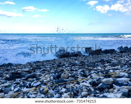 Sea waves on pebble beach