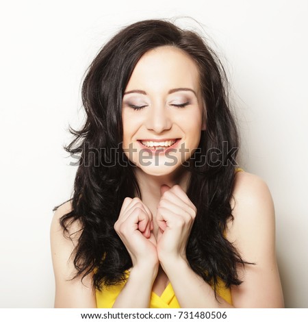 lifestyle, people and emotional concept: picture of surprised woman face over white