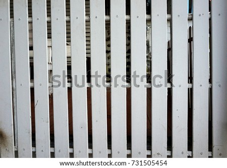 Small wooden fence painted white color
