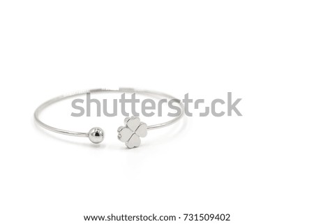 Close up shot of beautiful silver bracelet with clover isolated on white background