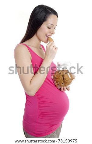 Pregnant woman eating a biscuit