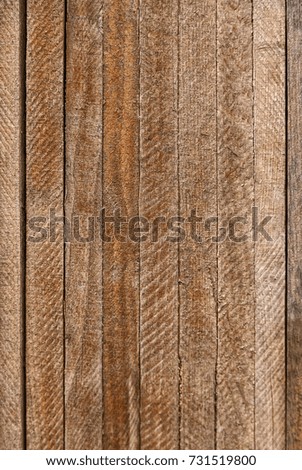 texture vertical frame wooden narrow boards natural color of wood with cracks and stripes
