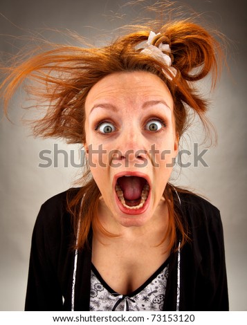 Portrait of very surprised bizarre screaming housewife Royalty-Free Stock Photo #73153120