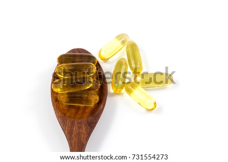 Healthy Vitamins, Omega 3,isolated,isolated on white background, Omega 3 cod liver oil capsules in the wooden spoon, skin care, pharmacy.