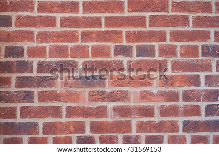 Old wall of red briks tiled background, regular block texture. Wallpaper of ordinary building. Background Royalty-Free Stock Photo #731569153