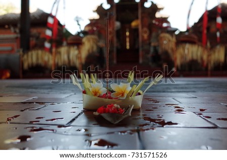 offerings are an essential part of Balinese dance performances as they serve to purify and sanctify the space before the dance begins with temple background