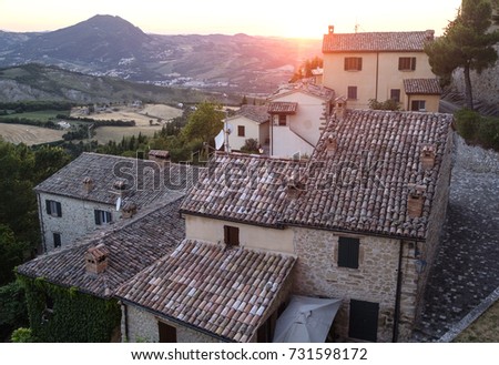 Sunset at San Leo (Forli Cesena, Emilia Romagna, Italy): landscape from the historic town at evening