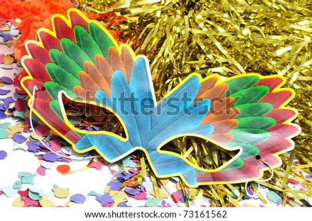 carnival mask, tinsel and confetti of different colors