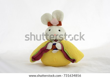 Rabbit doll in korean dress On a white background
