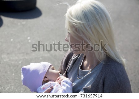 girl with a young child who sleeps