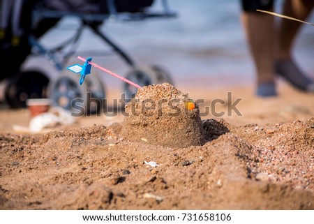 Boy making snad shapes on the beach