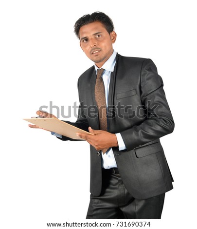 Businessman in black suit with clipboard over white background