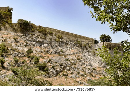 stone buildings and walls in the mountains