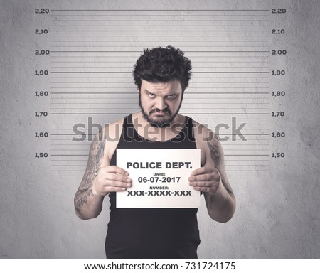 Caught gangster in jail with table on his hand.