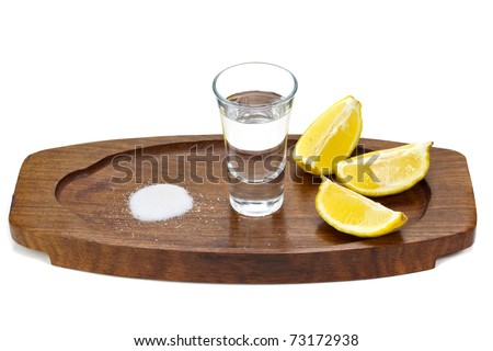 Silver tequila shot with salt and lemon