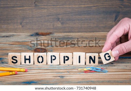Shopping. Wooden letters on the office desk. Business and holiday background