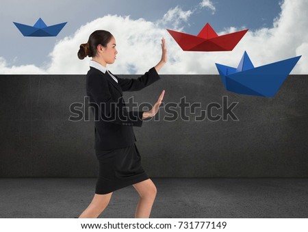 Digital composite of Businesswoman with paper boats