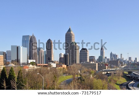 A view of the skyline of Atlanta, Georgia with midtown in the foreground and downtown in the background.