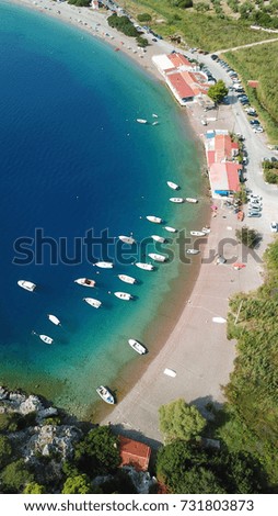 Aerial bird's drone photo of exotic turquoise clear water beach with boats docked