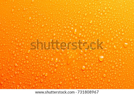 Water Drops On Orange Background Texture colorful waterdrop Royalty-Free Stock Photo #731808967