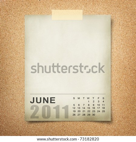 Calendar 2011 Note paper pined on cork board. june