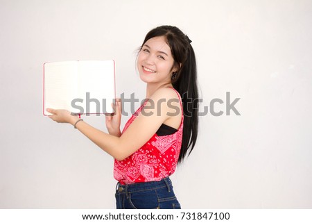 Portrait of thai adult beautiful red shirt read red book