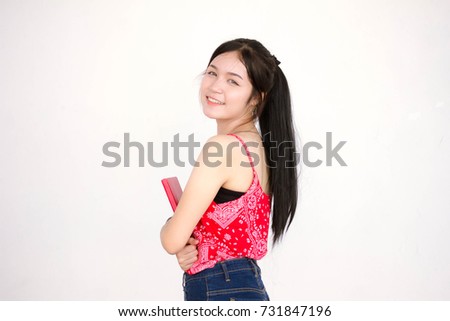 Portrait of thai adult beautiful red shirt read red book