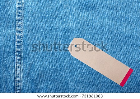 Denim jeans background with seam of jeans fashion design and tag