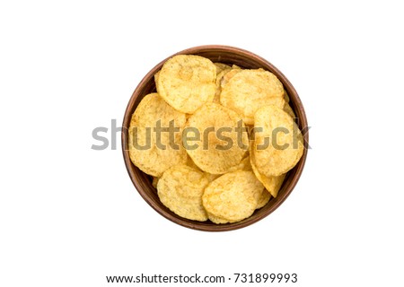 Bowl with potato chips isolated on white. Top view. Royalty-Free Stock Photo #731899993