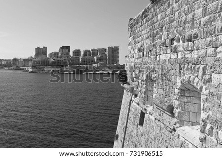 View of the modern quarter of Sliema from the Fort of Valletta. Tas-Sliema is a town located on the northeast coast of Malta in the Northern Harbor District. Black and white picture